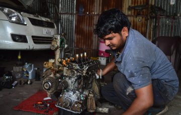 mechanic fixing an engine