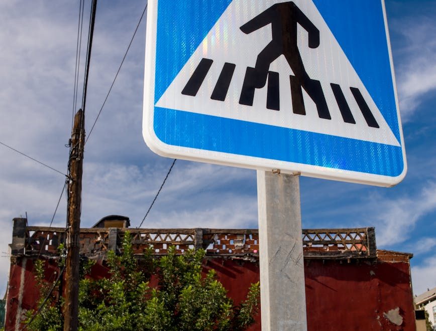 pedestrian crossing sign on urban street