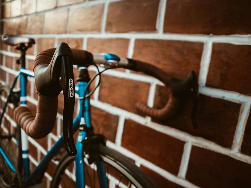 selective focus photography of blue road bike