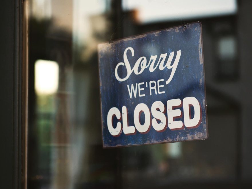 blue and white sorry we re closed wooden signage